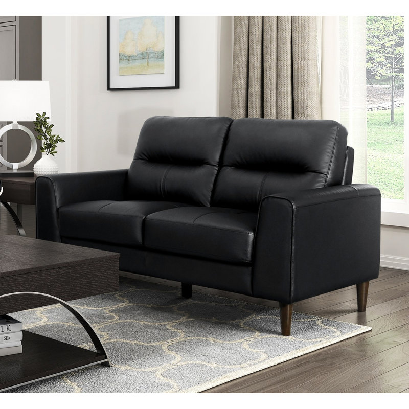 Cuir noir avec mousse à haute densité, structure en bois massif, assise de 20,5 po de profondeur, coussins en mousse de style rétro, largeur du produit de 34,5 po, lignes
