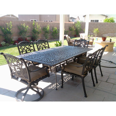 Badis 6 - Person Patio Dining Set Rectangular Table with Cushions Included
