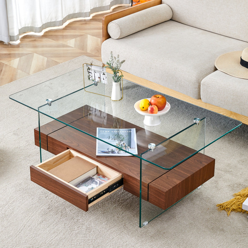 Table basse moderne à deux niveaux de 43,3 pouces - verre trempé transparent et grain de bois foncé, conception de rangement multifonctionnelle. L'étage inférieur comprend un tiroir. Peut être utilisé comme table basse, table d'appoint, etc.