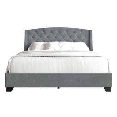 Laksha Upholstered Wingback Storage Bed
