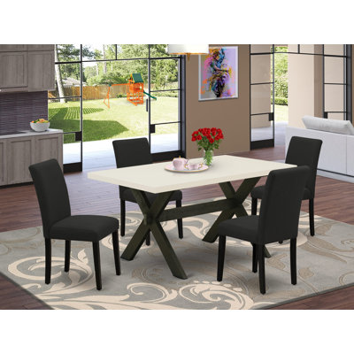 L'ensemble de 5 tables de cuisine pour 4 personnes comprend une table de salle à manger rectangulaire avec pieds en X et 4 chaises rembourrées en tissu de couleur noire, finition noire brossée