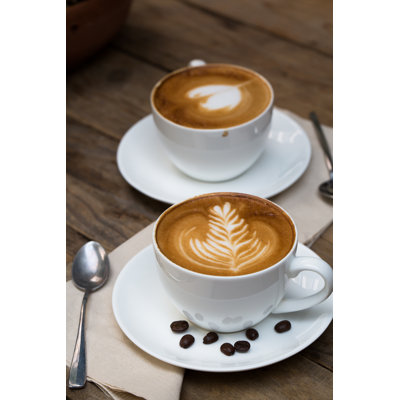 Cup Of Hot Latte Art Coffee by Nutnarin - Wrapped Canvas Print
