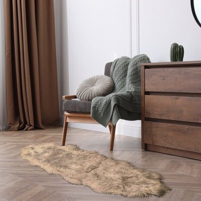 Novelty Backler Handmade 2' x 6' Sheepskin Area Rug in Brown