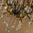 Jeannet Mid-Century French Style 6-Light Crystal Chandelier in Matte Black and Antique Gold Finish For Versatile Interiors