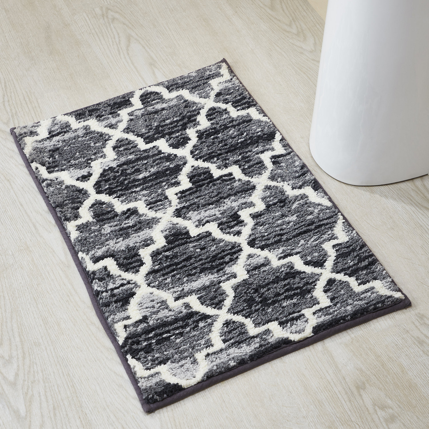 https://assets.wfcdn.com/im/87301835/compr-r85/2628/262814987/savio-bath-rug-with-non-slip-backing.jpg