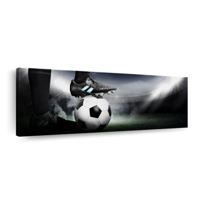 Crampons sur ballon de soccer sur toile
