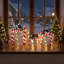 Coffrets cadeaux roses pailletés en 3 pièces avec pommes de pin, accents de cannes de Noël rouges et blanches et feuillage persistant pour la décoration de Noël