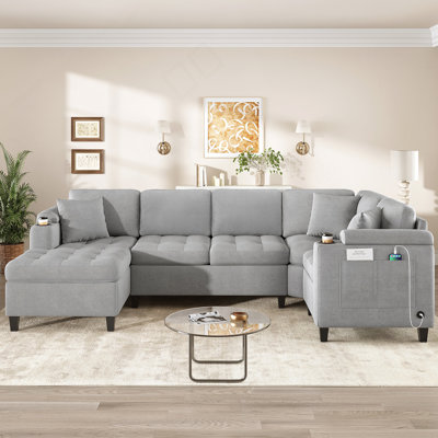 Canapé modulaire moderne en forme de U avec commodités intégrées, idéal pour une détente confortable et un divertissement dans les espaces de vie