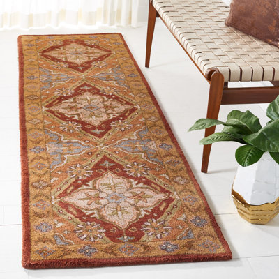 Tapis en laine, coton et latex rouille à motif floral touffeté à la main Ezell