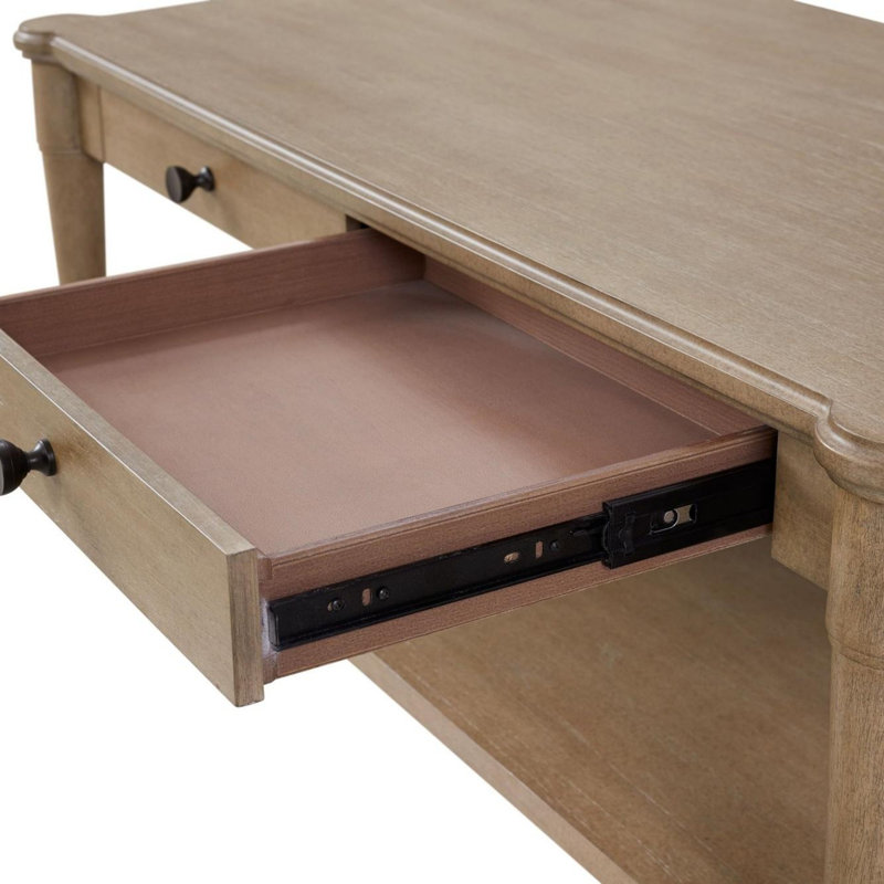 Table basse couleur sable avec deux tiroirs de rangement et roulettes
