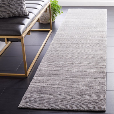 Tapis de performance uni tissé à la main Bliven