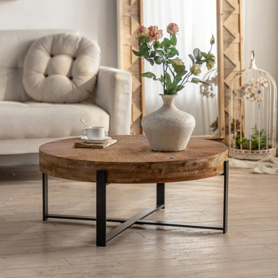 Table basse ronde rétro avec plateau en bois de sapin et pieds croisés