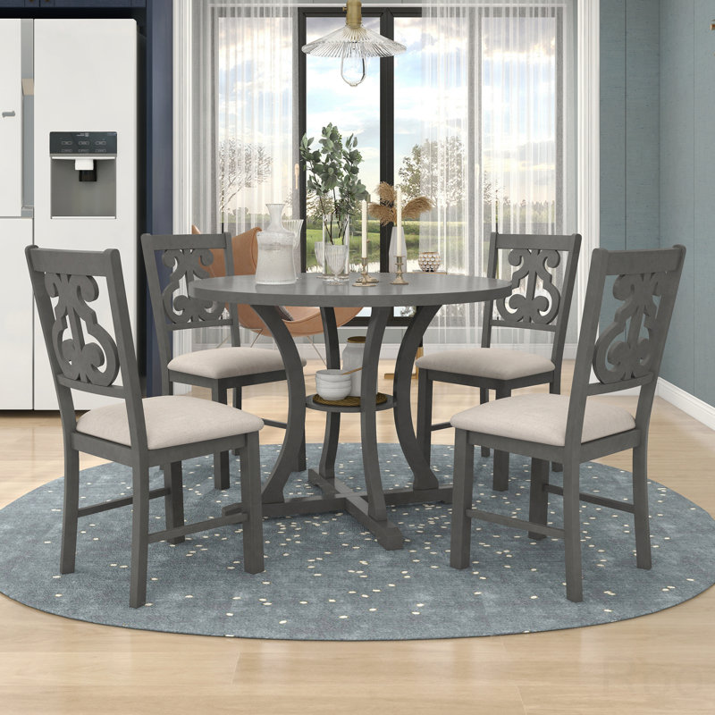 Ensemble 5 pièces de table de salle à manger et de chaises rondes avec des pieds de forme spéciale et un dossier creux de conception exquise
