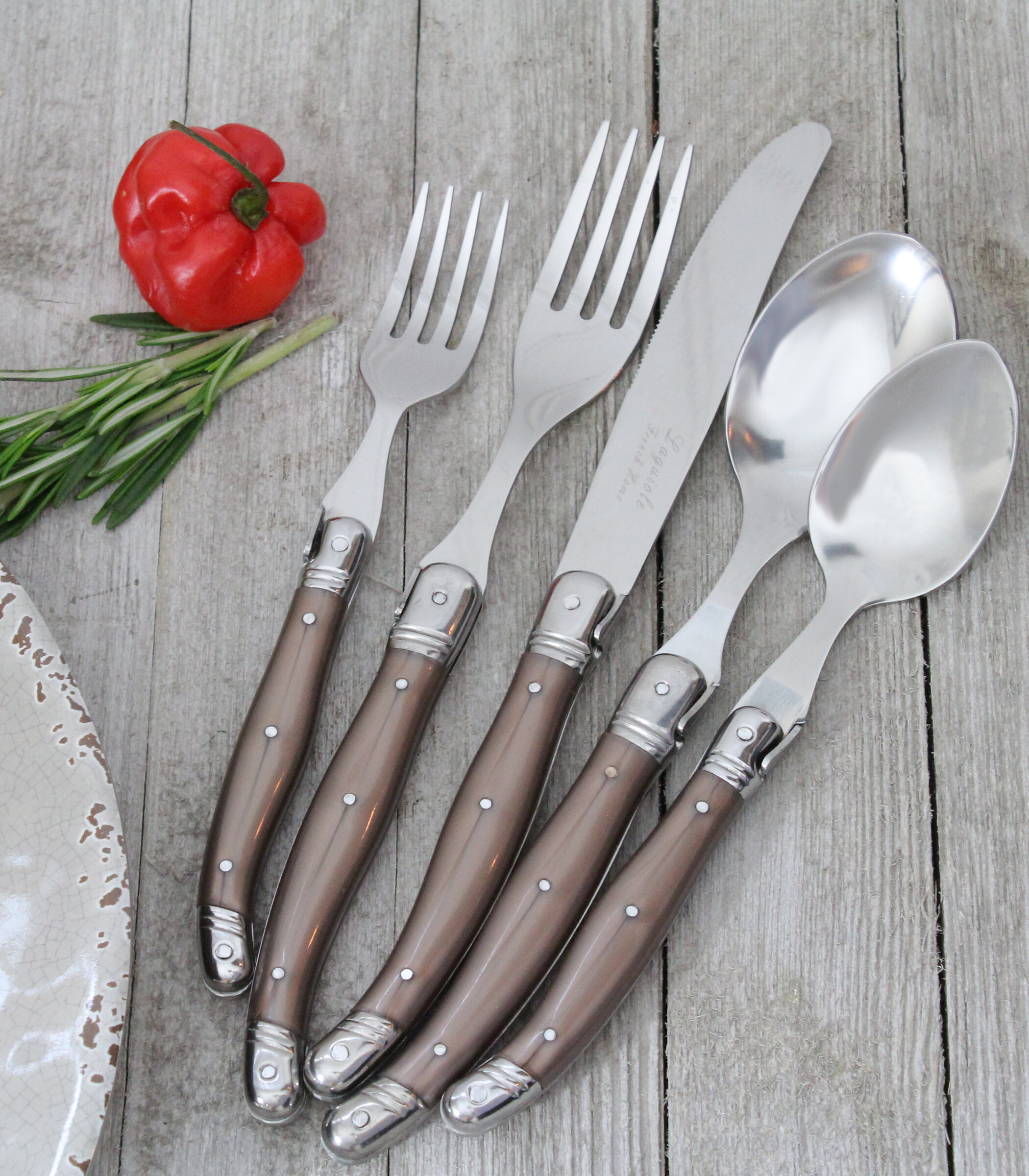 https://assets.wfcdn.com/im/87409340/compr-r85/1040/104088117/french-home-french-home-laguiole-stainless-steel-flatware-set-service-for-4.jpg