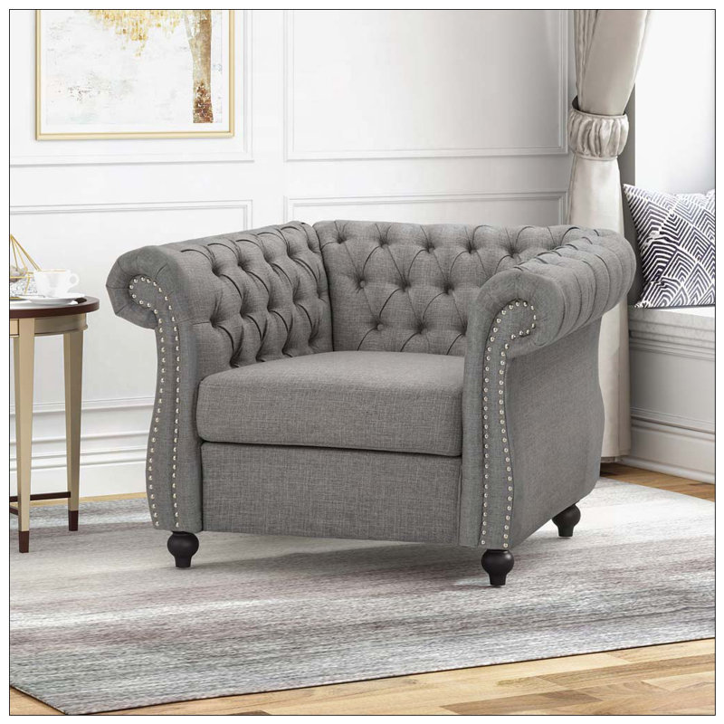 Fauteuil club capitonné