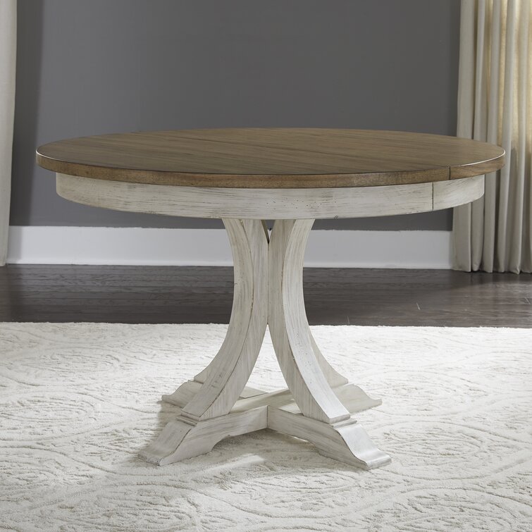 https://assets.wfcdn.com/im/87425560/resize-h755-w755%5Ecompr-r85/1685/168555276/Xochitl+Extendable+Round+Dining+Table.jpg