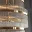 Geira Grand 21lt Tiered Pendant light finished in Ant. Brass