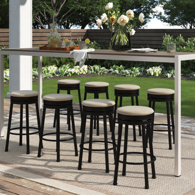 Coggeshall Swivel Patio Bar Stool with Cushion by Three Posts