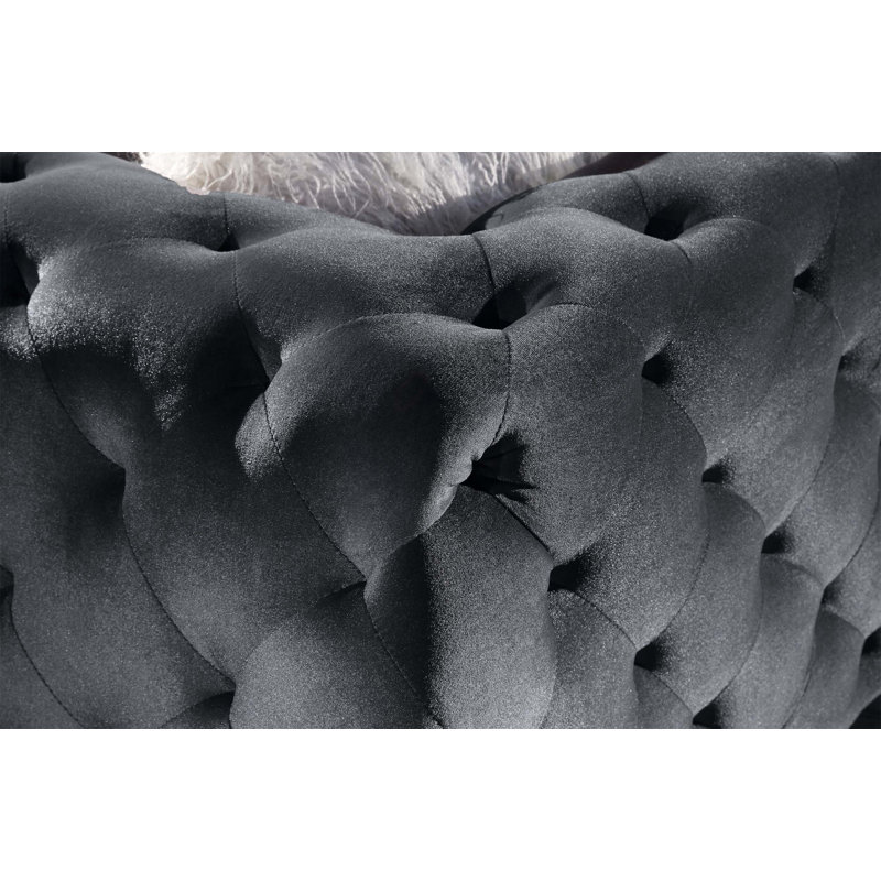 Élégant canapé de salon en velours avec capitonnage et repose-pieds, idéal pour créer un environnement luxueux et confortable