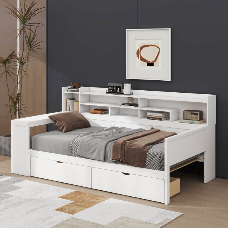 Lit de jour simple en bois avec rangement intégré, deux tiroirs et un bureau d'étude à côté pour une utilisation polyvalente