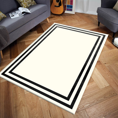 Tapis blanc / noir tissé à la machine Ashunti