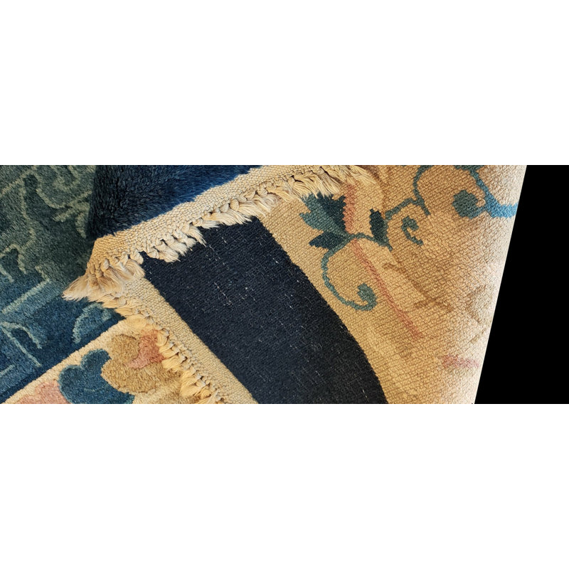 Tapis ivoire antique en laine bleu