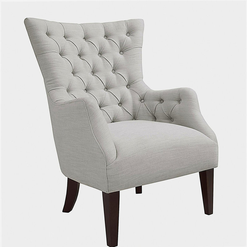 Fauteuil à oreilles capitonné