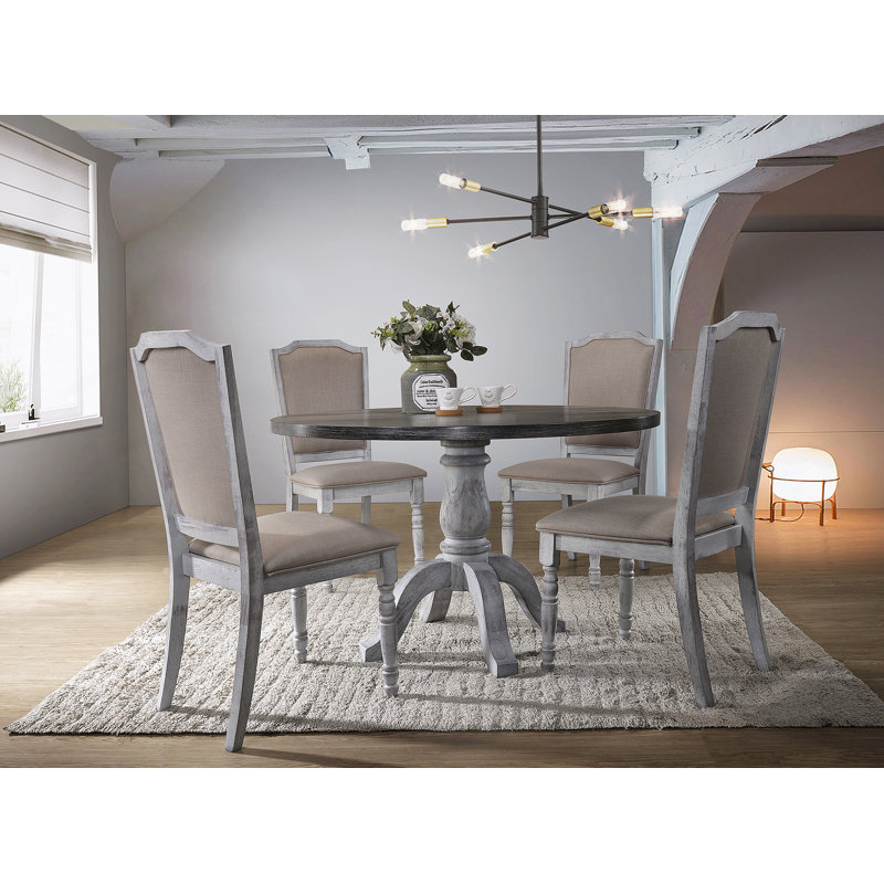Ensemble de cinq tables de salle à manger pour les salles à manger compactes, idéales pour les maisons modernes avec des caractéristiques d'économie d'espace et de confort.