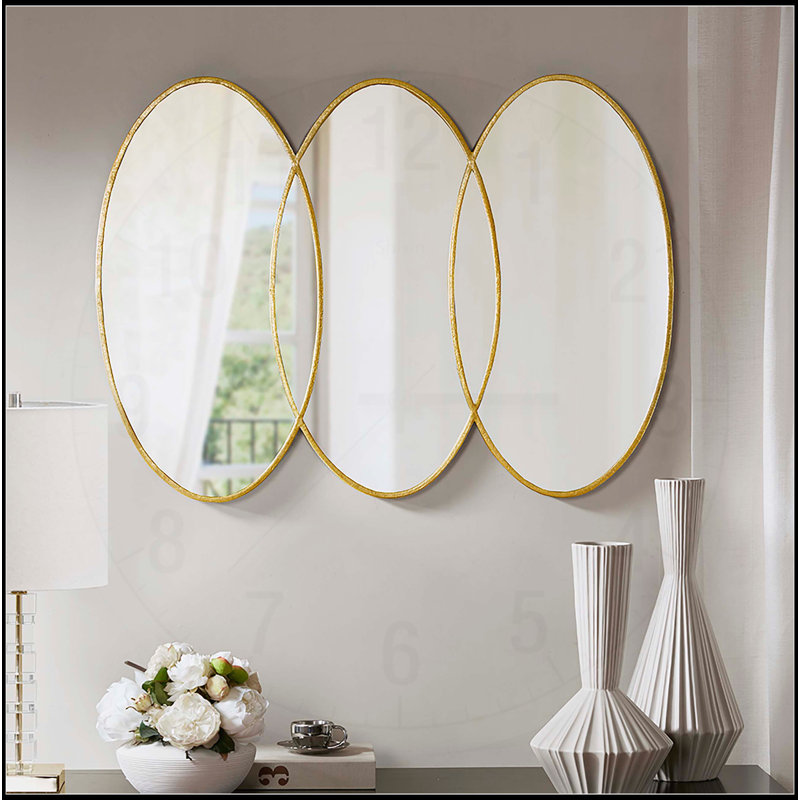 Élégant miroir mural Trio doré avec finition antique et motif superposé