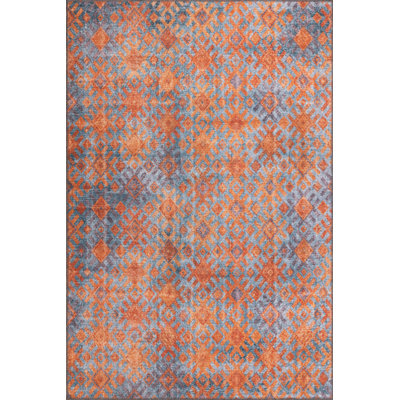 Tapis décoratif à motif géométrique orange et bleu