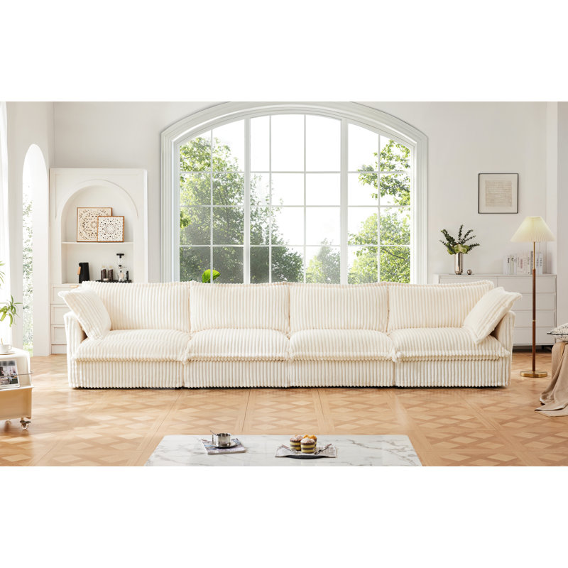 Canapé quatre places en velours côtelé, housse amovible pour plus de commodité, assise extra profonde, confort optimal et élégance.