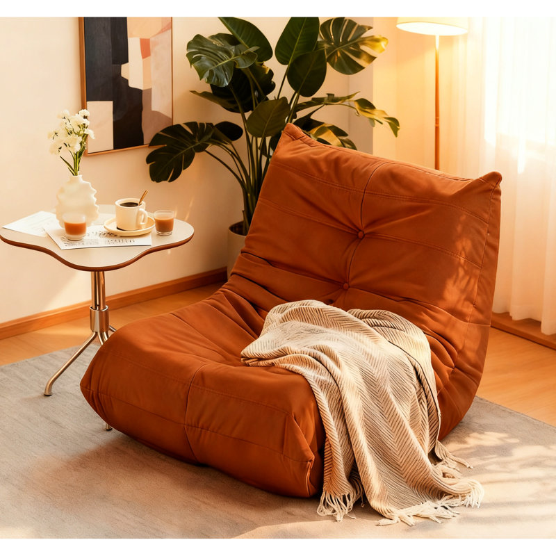 Fauteuil confortable orange avec boutons, mousse à mémoire de forme douce, assise coulissante, rembourrage en mousse