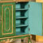 Banc de rangement vert en bois manufacturé