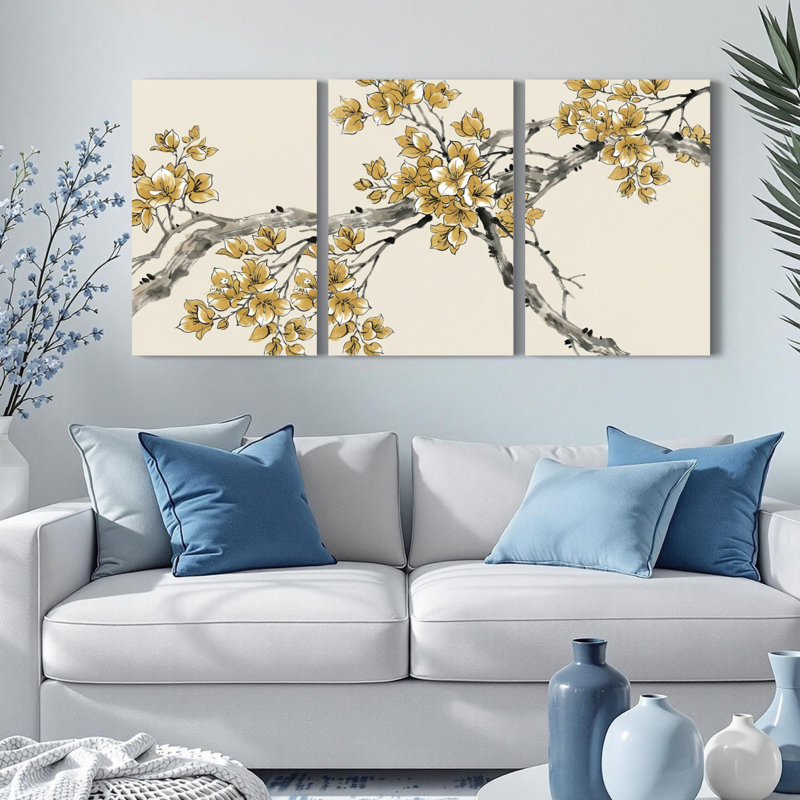Ensemble de 3 tableaux muraux sur toile de style oriental représentant des branches de cerisier en fleurs dorées.