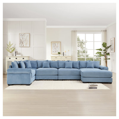 Canapé modulaire convertible surdimensionné en velours côtelé bleu avec repose-pieds ergonomique