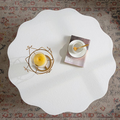 Scalloped White Coffee Table: Unique Wave-Edge Shape, Elegant Focal Piece For Stylish Spaces.