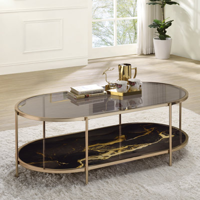 Table basse Fiorella, verre, marbre, peinture noire et finition champagne