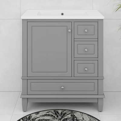 Meuble-lavabo 30 po avec lavabo en céramique, une porte avec tablette et trois tiroirs, poignées en métal