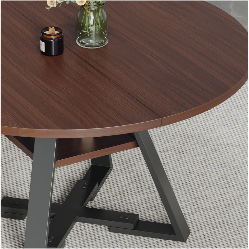 Round dining table in black walnut, 115cm.