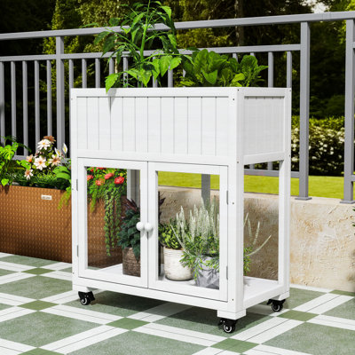 Mini serre en bois à structure froide en bois avec lit surélevé, portes en polycarbonate et roues amovibles