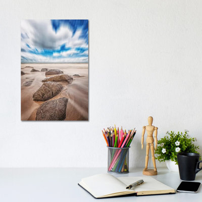 Stones On The Beach by Glauco Meneghelli - Wrapped Canvas Print