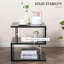 Table basse noire avec plateau relevable et en forme de S