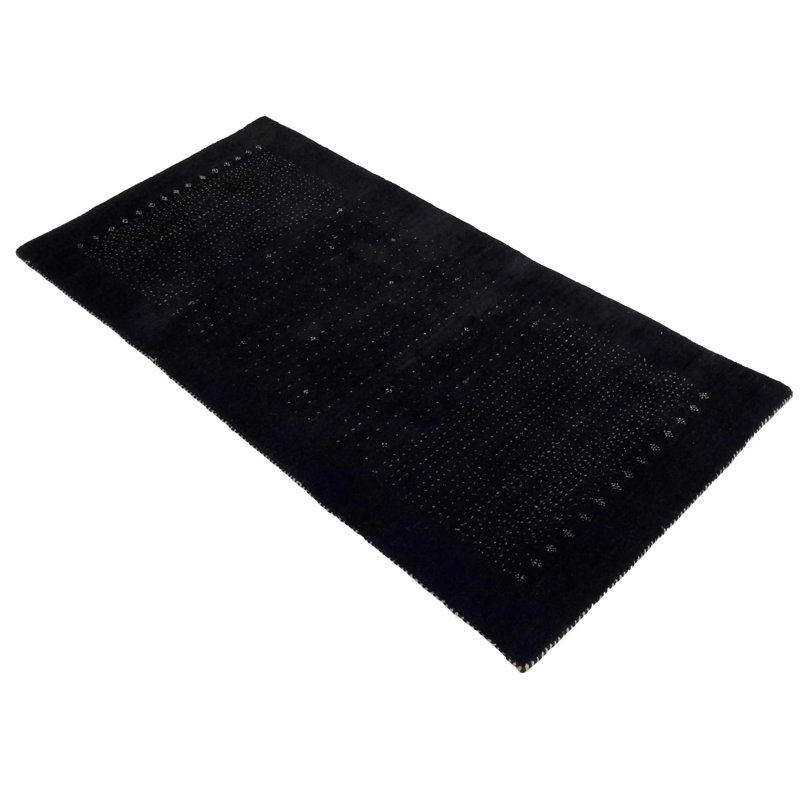 Ovide Polka Dots Area Rug in Black