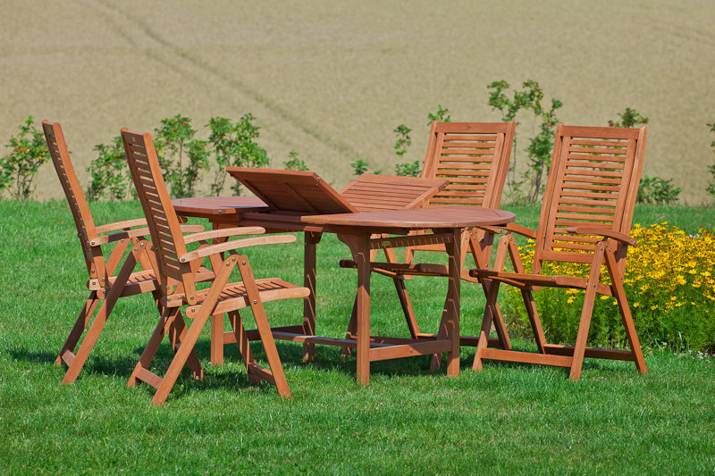 Adalmiina 4 - Person Wood Patio Dining Set with Extendable Oval Table