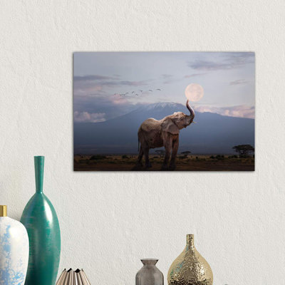 Elephant Holding Up Moon In Africa by Susan Schmitz - Wrapped Canvas Print