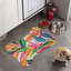 Tapis coloré en forme d'os - 1 pièce