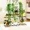 Support pour plante à 4 niveaux et 12 pots en métal, pour l'intérieur et l'extérieur, avec design décoratif en acier noir