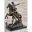 Statue de bronze d'un cowboy de l'Ouest