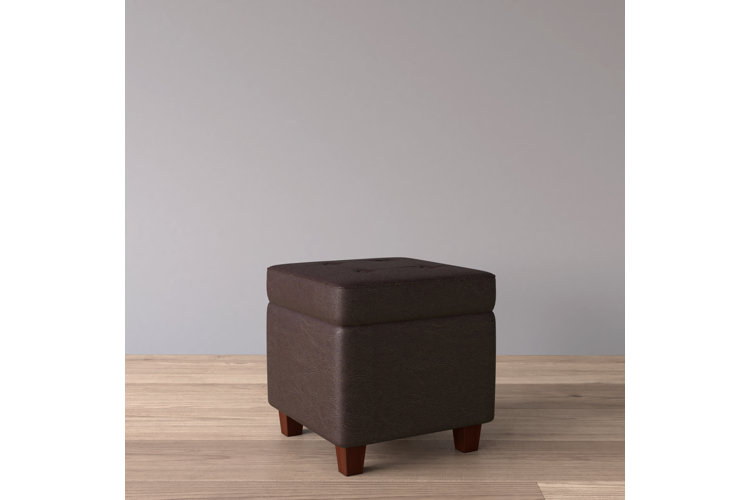 Charlton Home Gamalier 17.5 inch wide square storage ottoman in rich brown faux leather with a button-tufted top and tapered espresso wood legs
