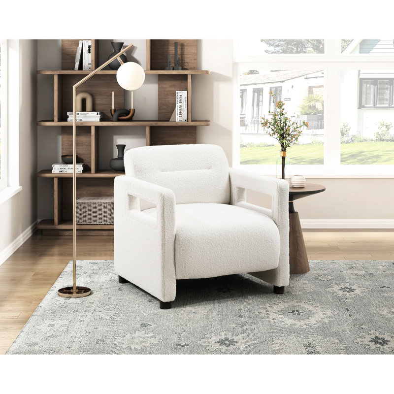 Fauteuil beige avec une structure en contreplaqué stable et un revêtement en forme de boucle pour un rembourrage élégant à structure tactile